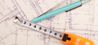 Building drawing with pen and measuring tape